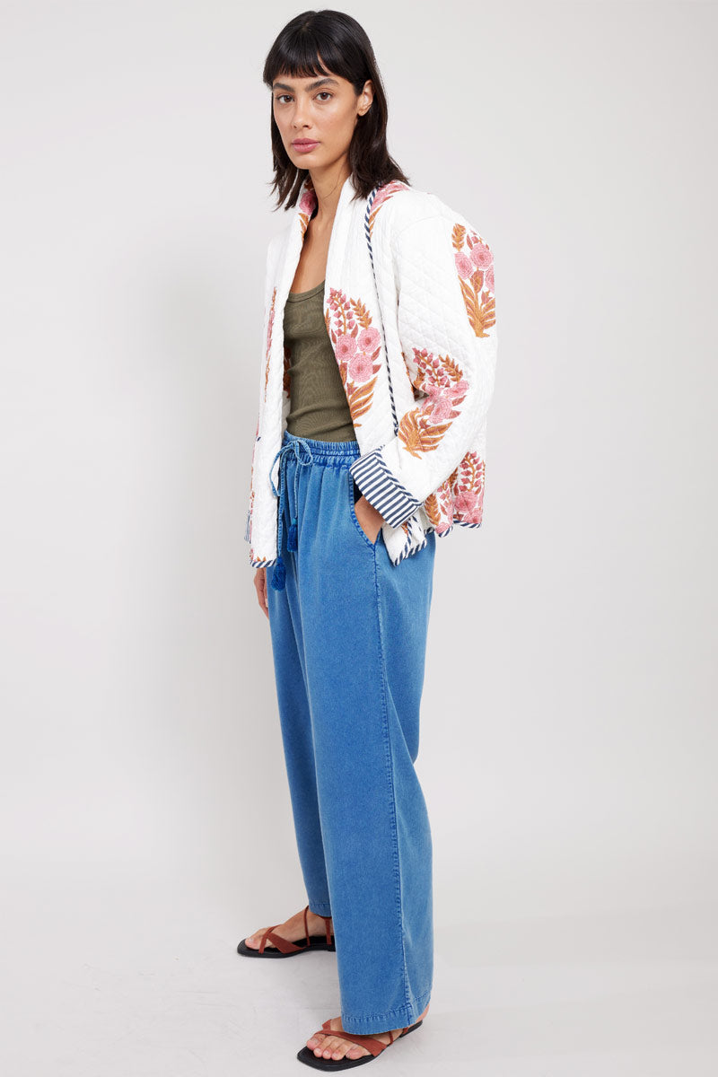 Side view of model wearing wearing East Kenzie Jacket with East Tessa Trousers