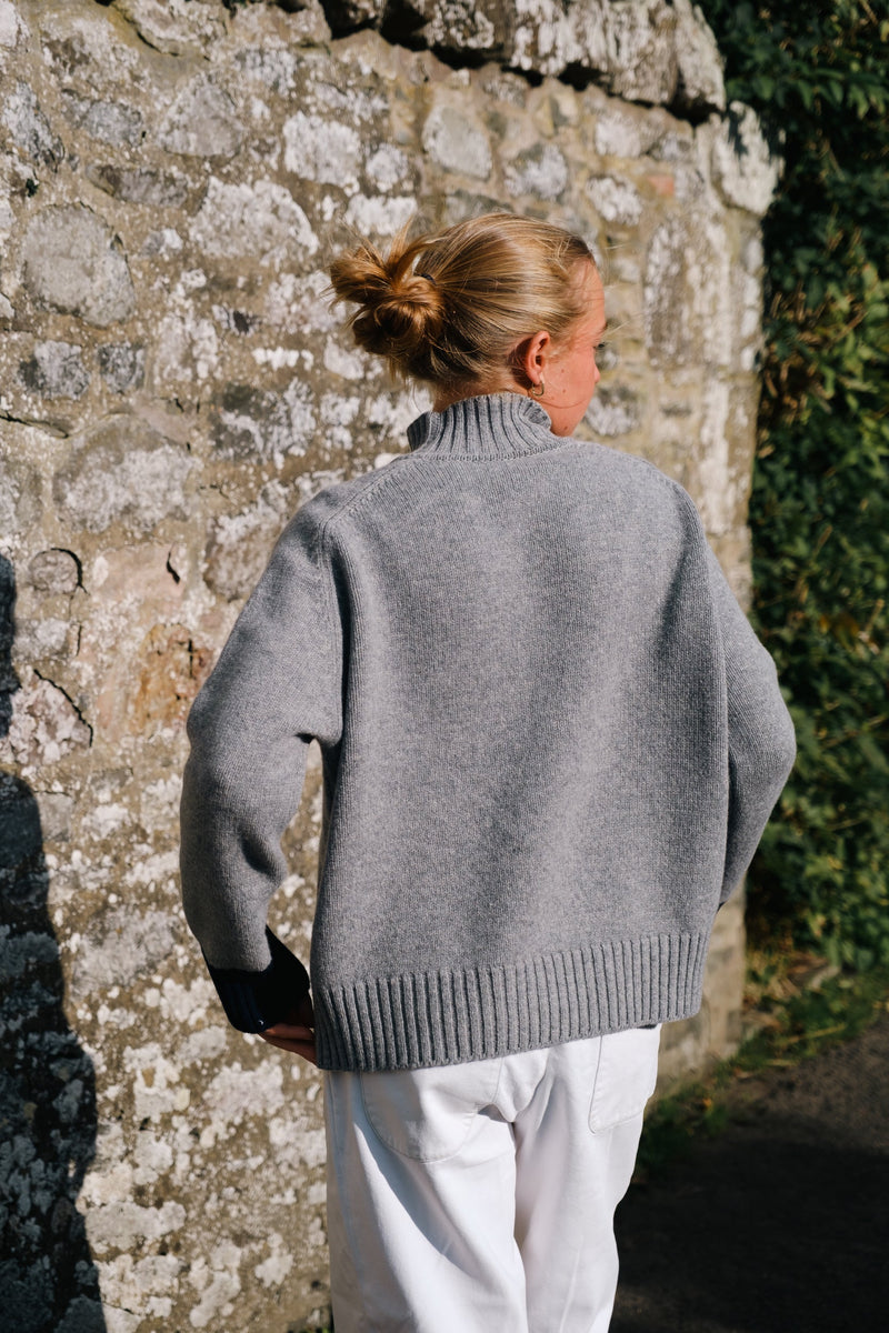 Maree knit is made with the finest Scottish spun lambswool. Knitted in a chunky luxurious 4 ply yarn with a funnel neck, contrast cuffs and a boxy, oversize fit. Traditionally made with fully fashioned knitting techniques and linked together by hand. Crafted within 80 miles of our design studio in the Scottish Borders.