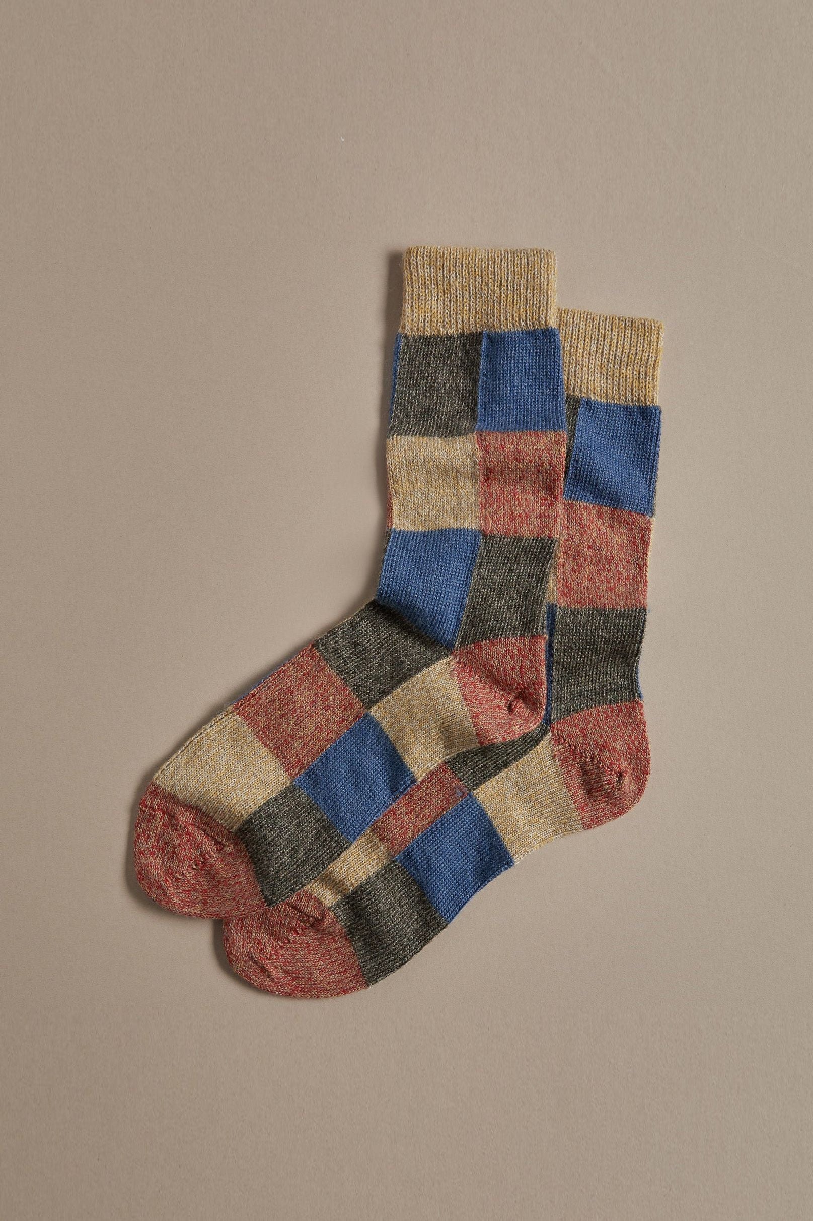 Patchwork merino wool socks in blue red and yellow, made in UK