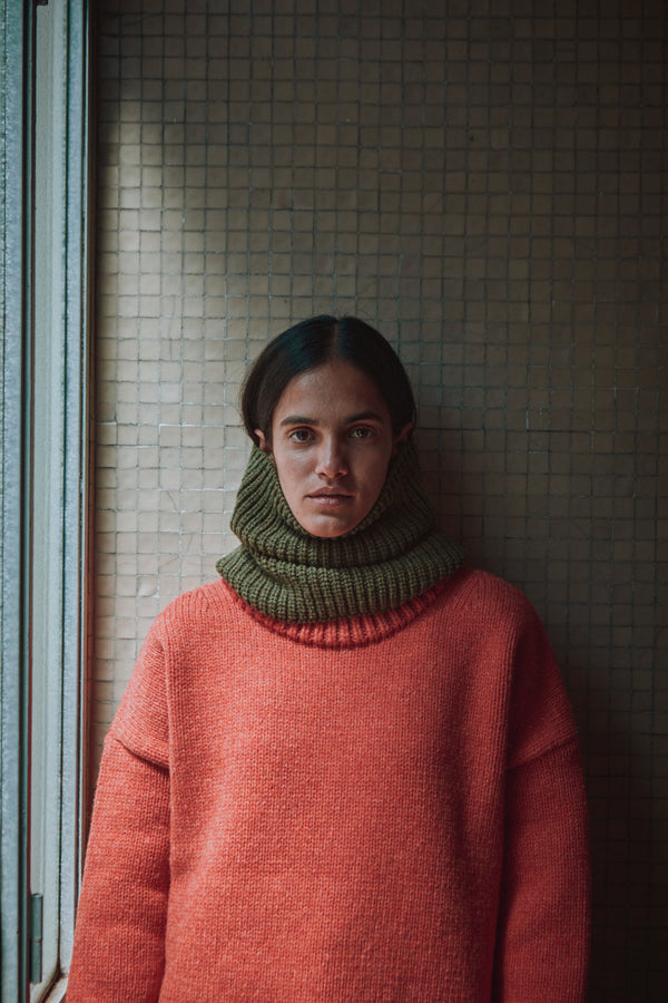 woman standing in front of all wall wearing AMANDINE Coral L'ENVERS 