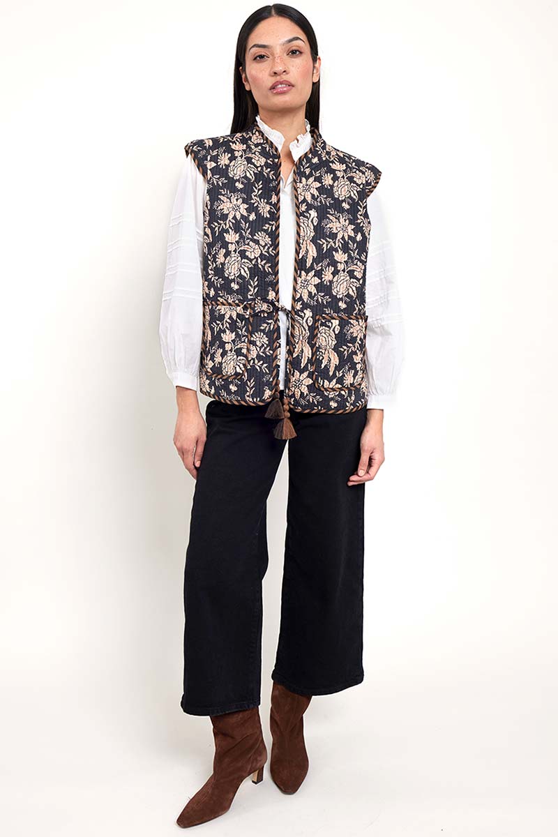 Model wears East Heritage Erin reversible Gilet 