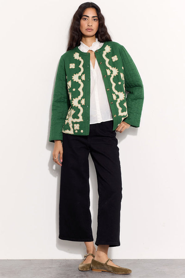 Model wears EAST Jill green applique quilted jacket.