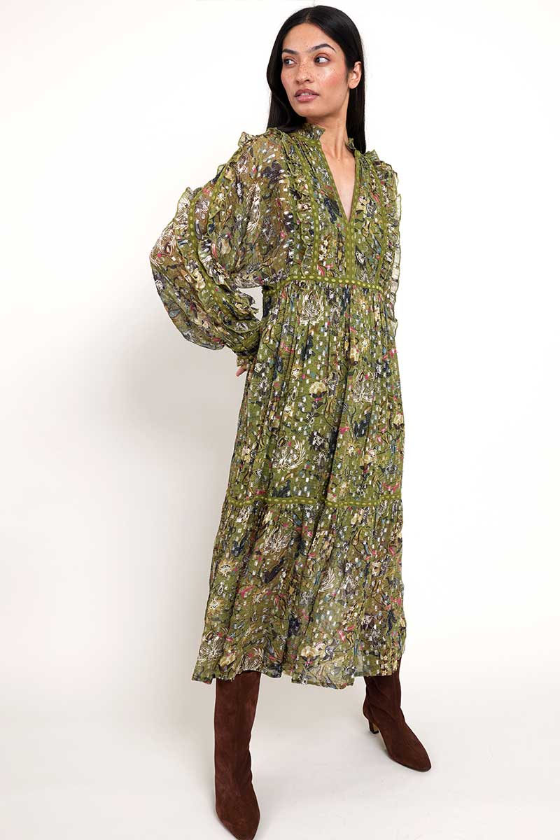 Model wears East Heritage Tahani Green printed lurex dress