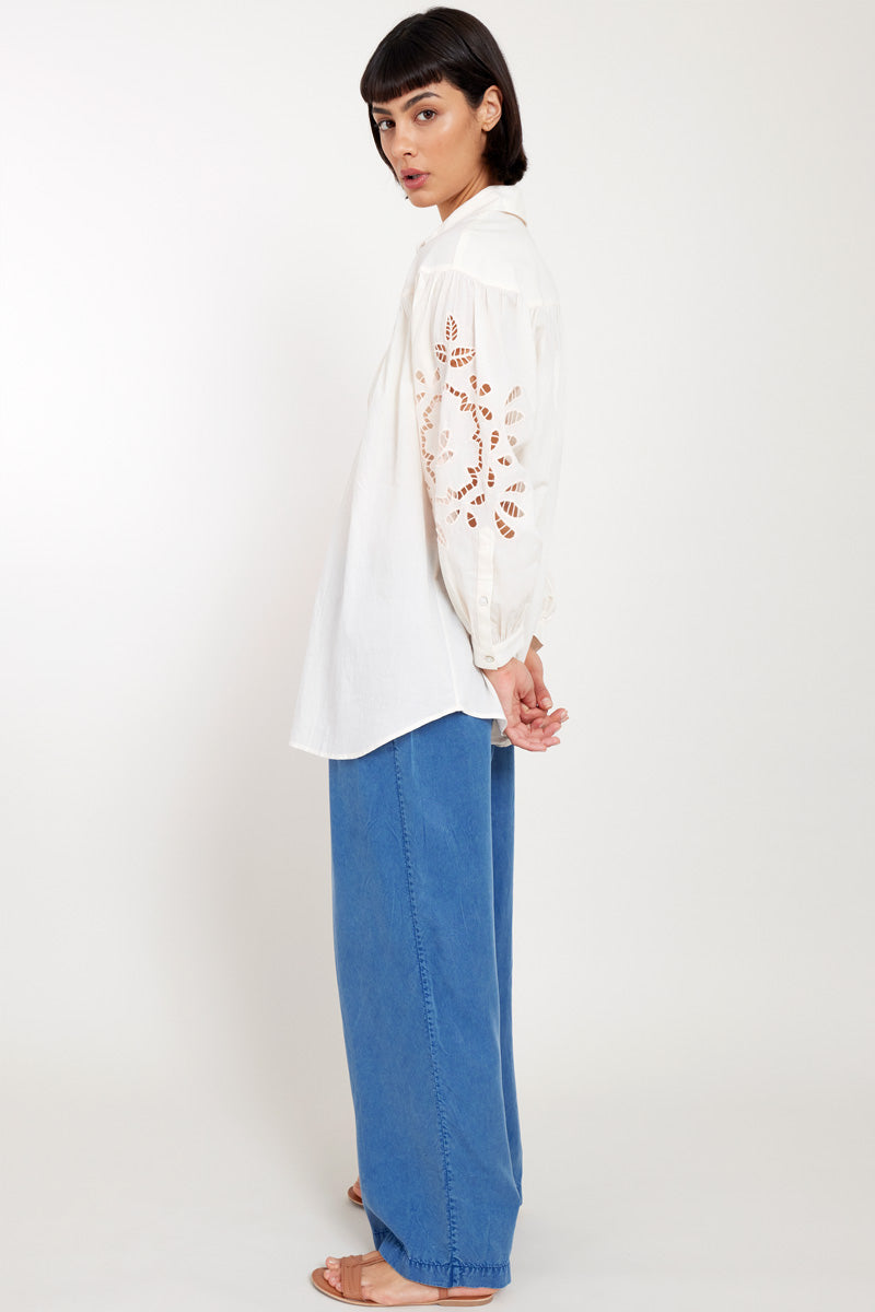 Side view of model wearing East Heritage Bridget Soft Peach Organic Cotton Shirt with the East Heritage Tessa Trousers