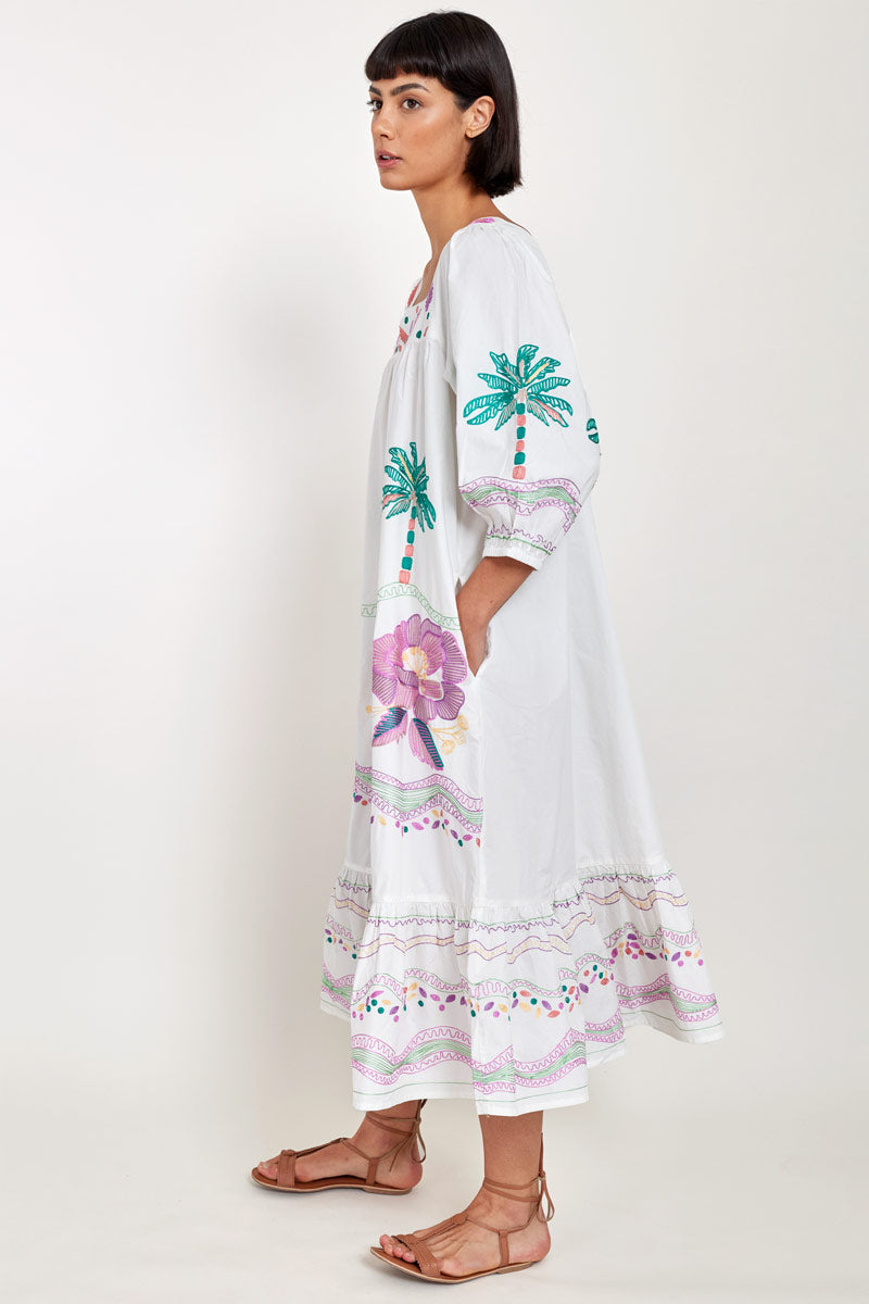 Side view of model wearing East Heritage Zarella Embroidered White Dress