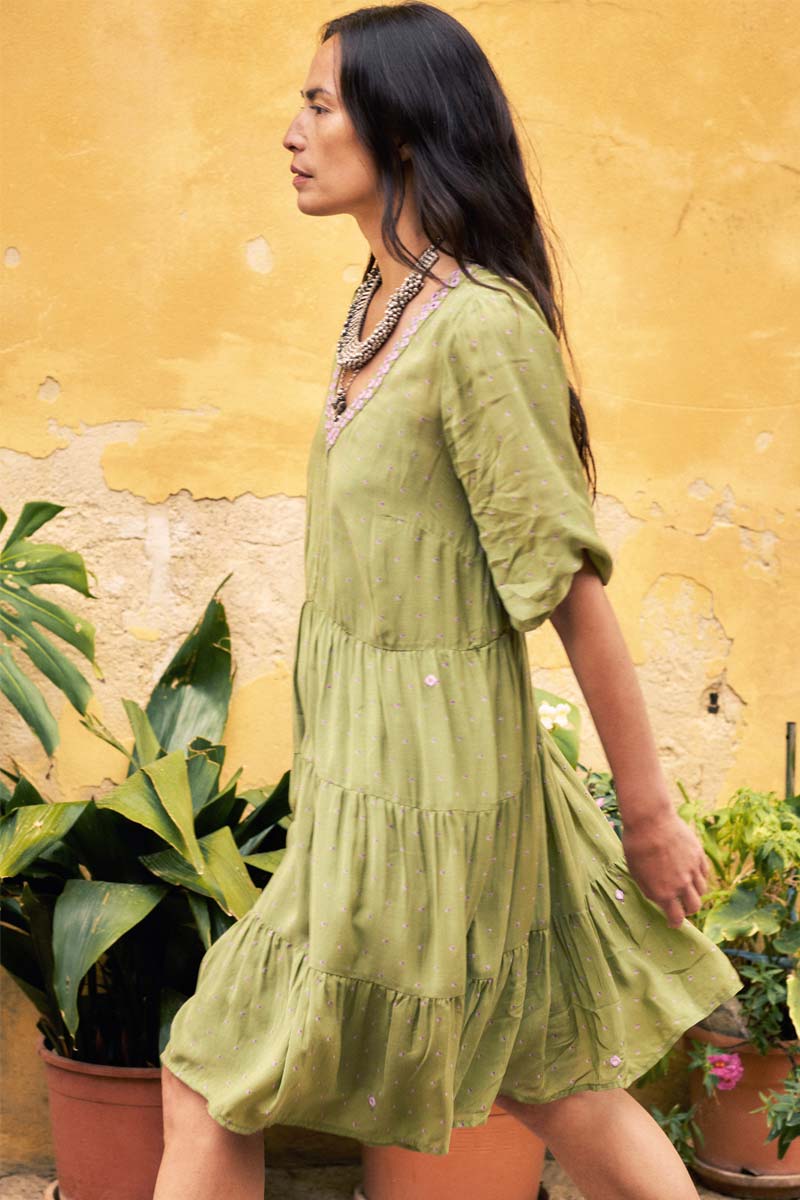Model wears East Malia Green Dress