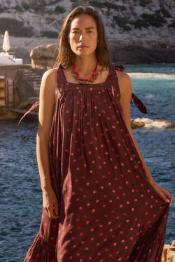Close up of model wearing East Paola Spot Sleeveless Dress