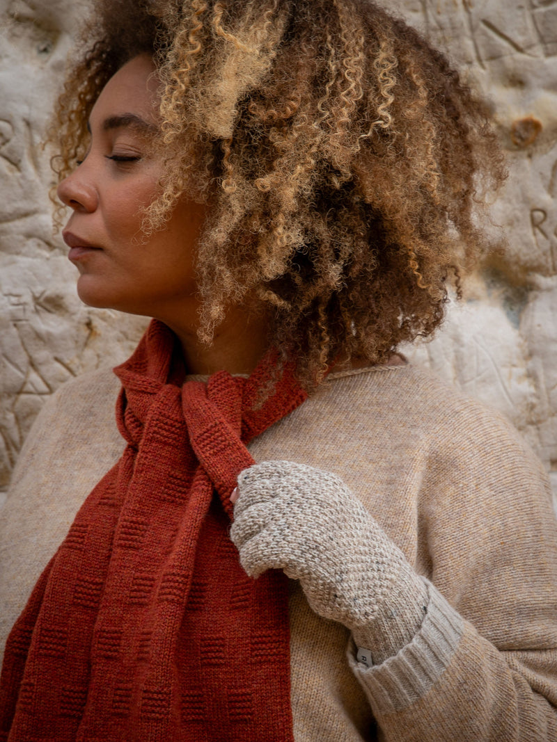 Model wears British Made British Wool Fingerless Gloves in Un-Dyed Nepp and Garter Stitch Scarf in Rust