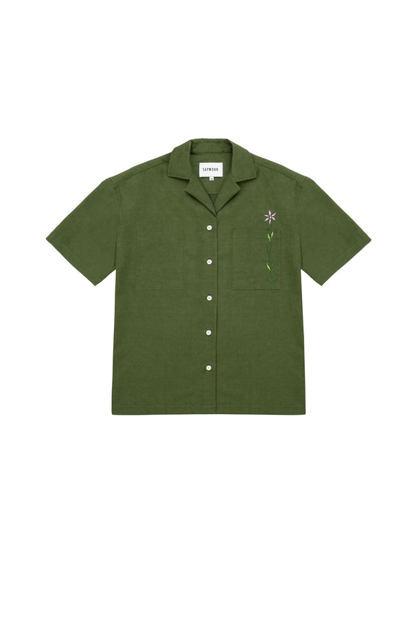 Unisex Olive Green Short Sleeve Cuban Shirt, with embroidered flower through chest pocket. Saywood Frances Unisex Cuban Shirt, made in London.