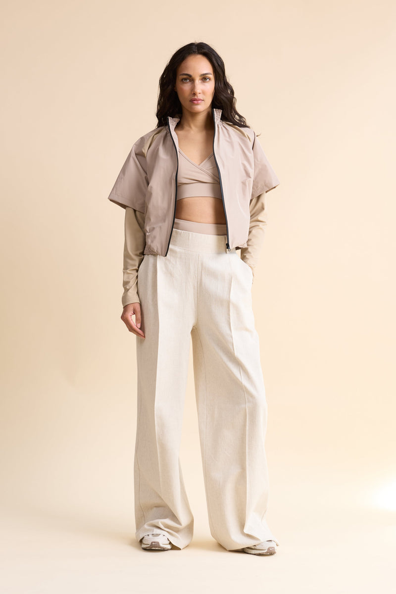 HRMN8 Women's cream wide-leg linen trousers, breathable high-waisted summer pants with pockets and elastic waistband.