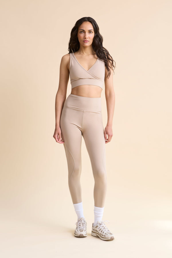 HRMN8 Women's beige Sculpt Leggings and Slip Wrap bra set, full-length, buttery-soft with contour seams, medium support for workouts or athleisure.