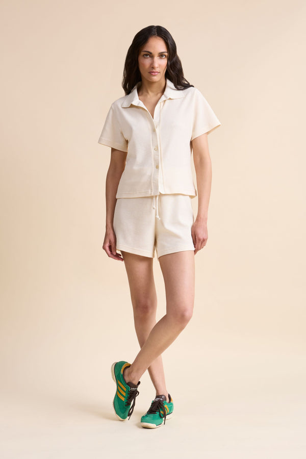 Women's beige HRMN8 waffle shorts with drawstring waist, soft textured fabric, relaxed fit for loungewear or summer layering.
