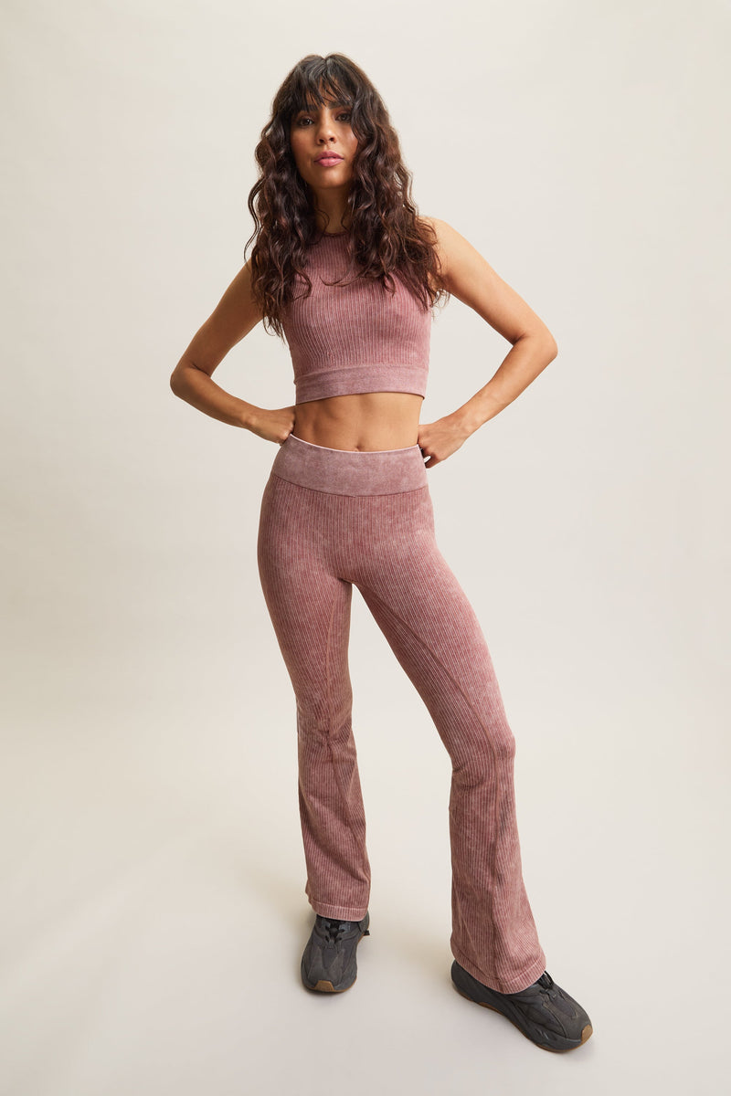 Women's HRMN8 pink orange Takeover Ribbed Cropped Top with an acid wash finish, featuring rib pin detailing, a seamless design, and a stylish cut-out back. Lettuce edge neckline adds a soft, feminine touch. Designed for athleisure, casual wear, and effortless styling. Pairs with the Takeover Flare Ribbed Leggings for a coordinated set.