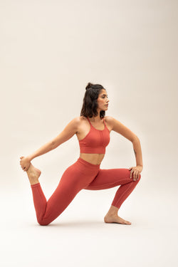 red orange cropped modal bra with high waisted red orange modal leggings from sustainable women's activewear brand Jilla.