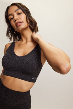 Cobalt Black Sahara Recycled Sports Bra by Jilla Active – Seamless, V-neck sports bra with animal jacquard design, four-way stretch fabric, removable pads, and wide underband for light to medium impact support, perfect for athleisure, gym, yoga, pilates, running and activewear.