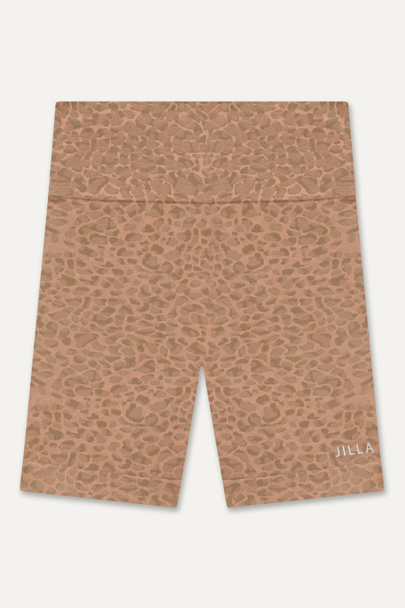 Prepare for summer with our Sahara Recycled Shorts, seamlessly knitted in our new animal jacquard. With a wide ribbed waistband and a mid-thigh finish, they're perfect for studio classes, gym workouts, and everyday style. The internal waistband elastic and four-way stretch fabric ensure they stay in place all day. Complete your look by pairing them with the matching bra and oversized tee from sustainable activewear brand Jilla Active