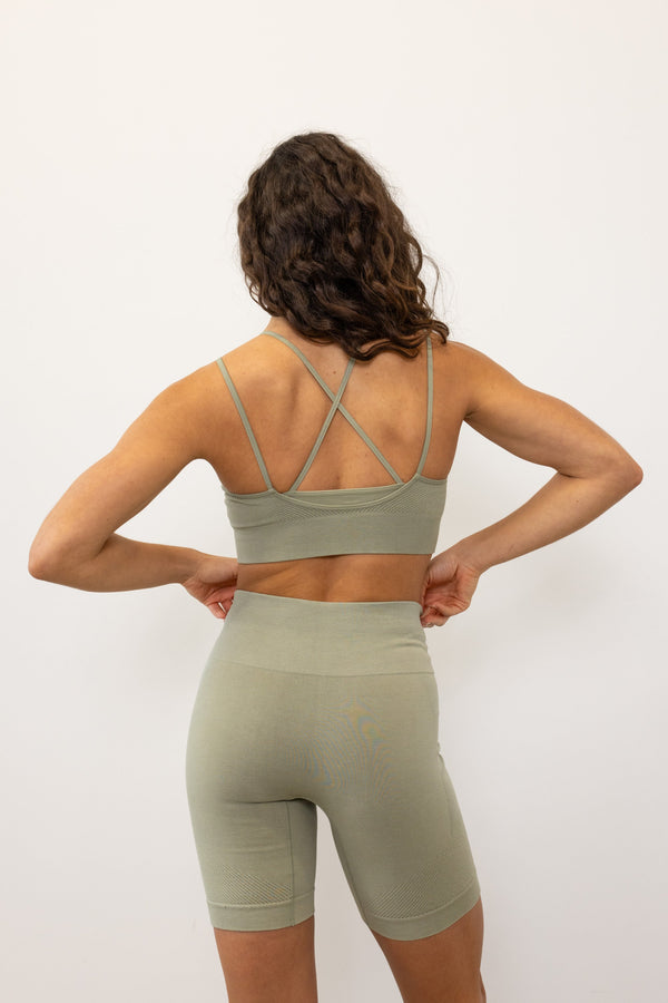 Enhance your workout gear with vibrant seagrass green ribbed recycled modal shorts and a padded, supportive sculpting sports bra from Jilla Active, a British sustainable activewear brand. Ideal for running, yoga, gym sessions, and pilates, our eco-friendly activewear blends style, comfort, and sustainability to meet your active lifestyle demands.