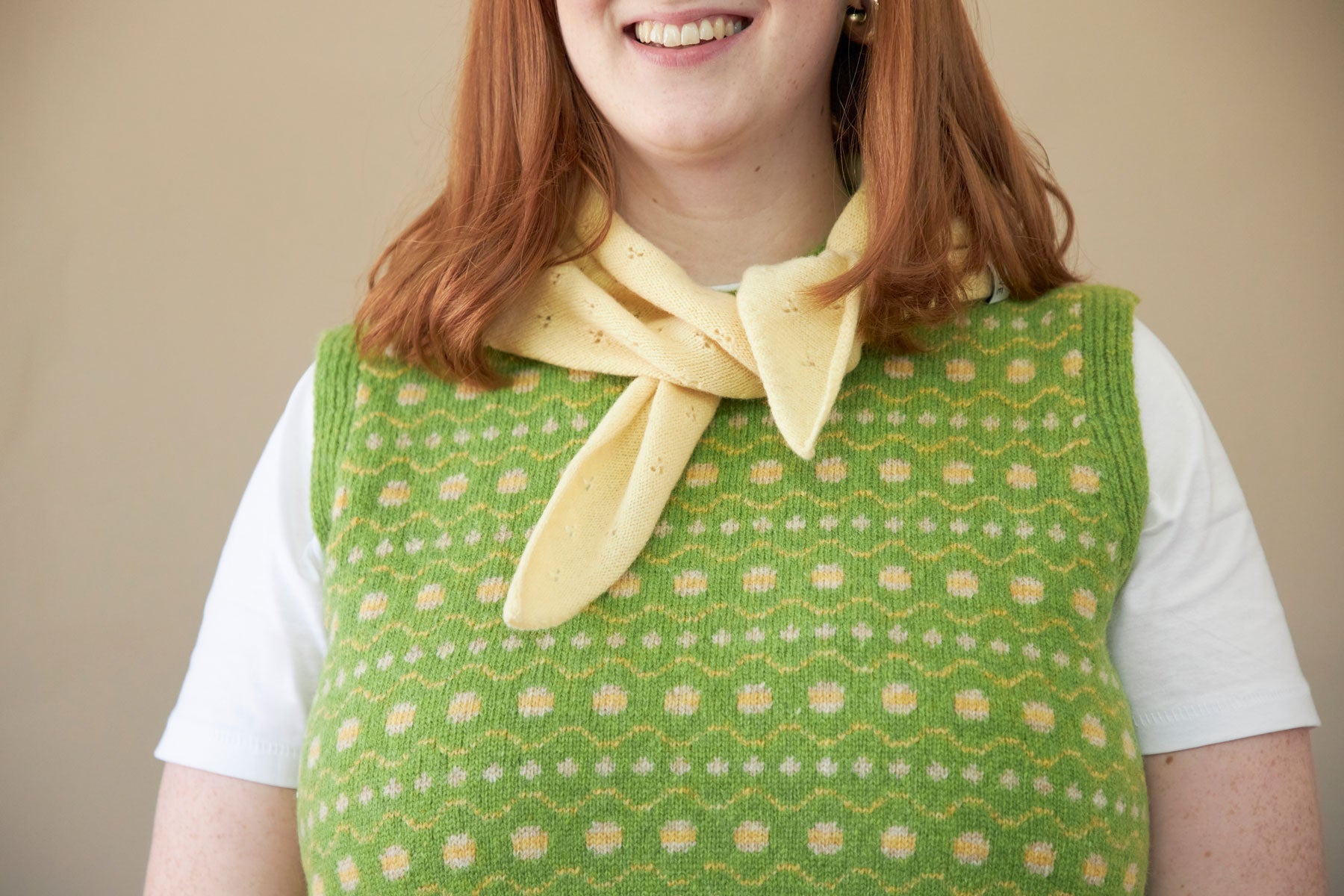 Model wears light Yellow lace neck scarf knitted in soft lambswool. designed and made in the UK by Rove.