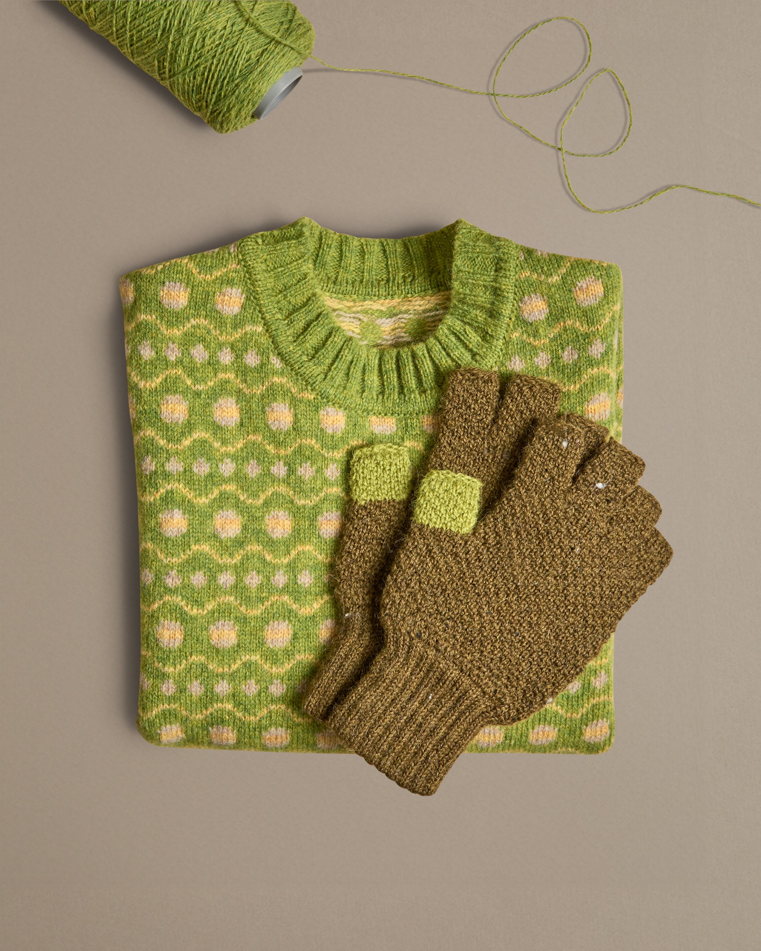 A lime green and yellow fair isle vest. Knitted in Scottish spun wool, designed and made in Britain. 