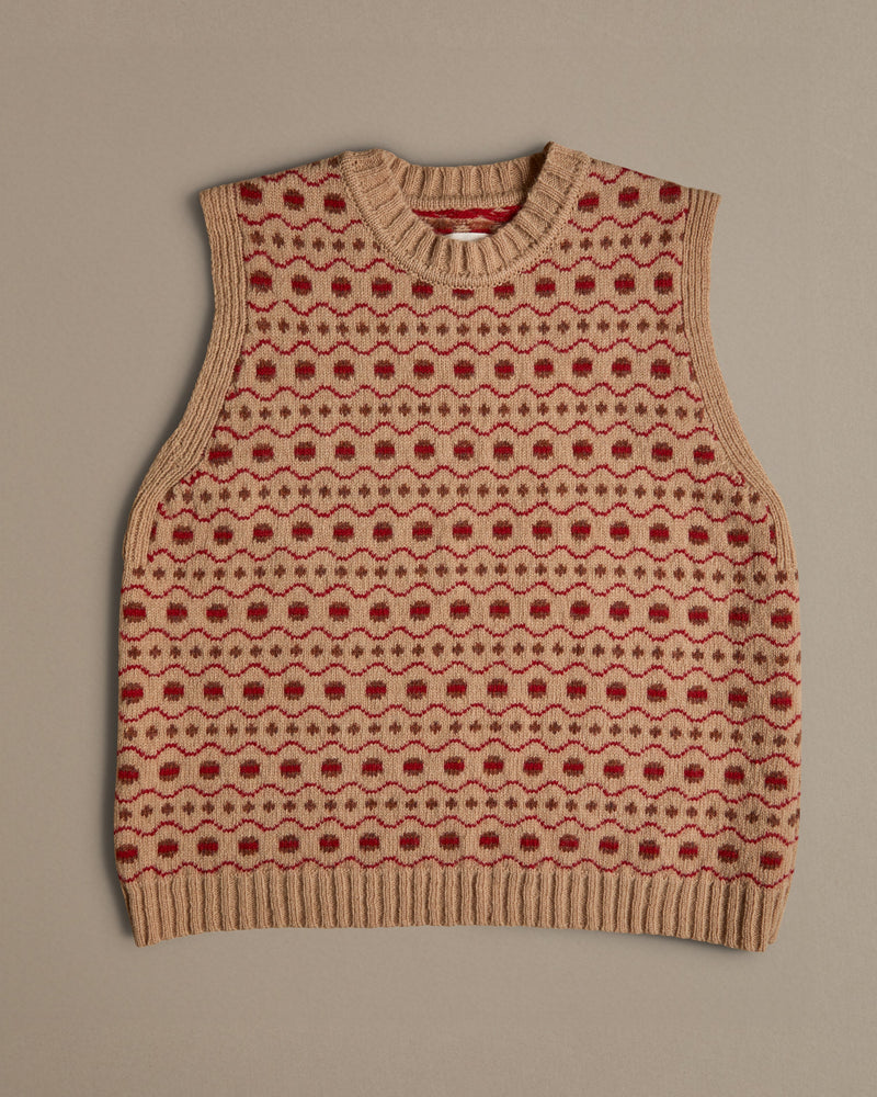 A beige and red Fair Isle vest, knitted in Scottish spun wool. Designed and made in Britain. 