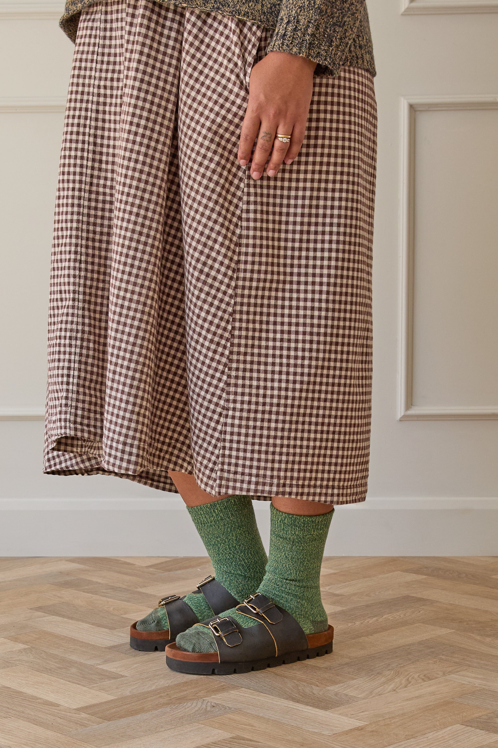 Model wearing green merino wool socks, with Birkenstock sandals. Designed and made in Britain. 