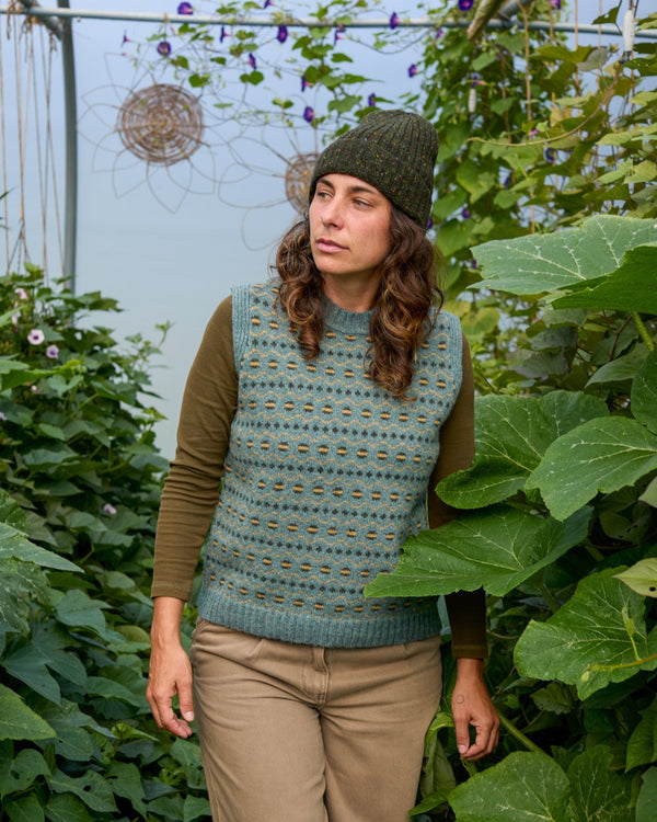 Model wearing Fair Isle Vest in blue. made from Scottish spun wool, designed and made in Britain. 