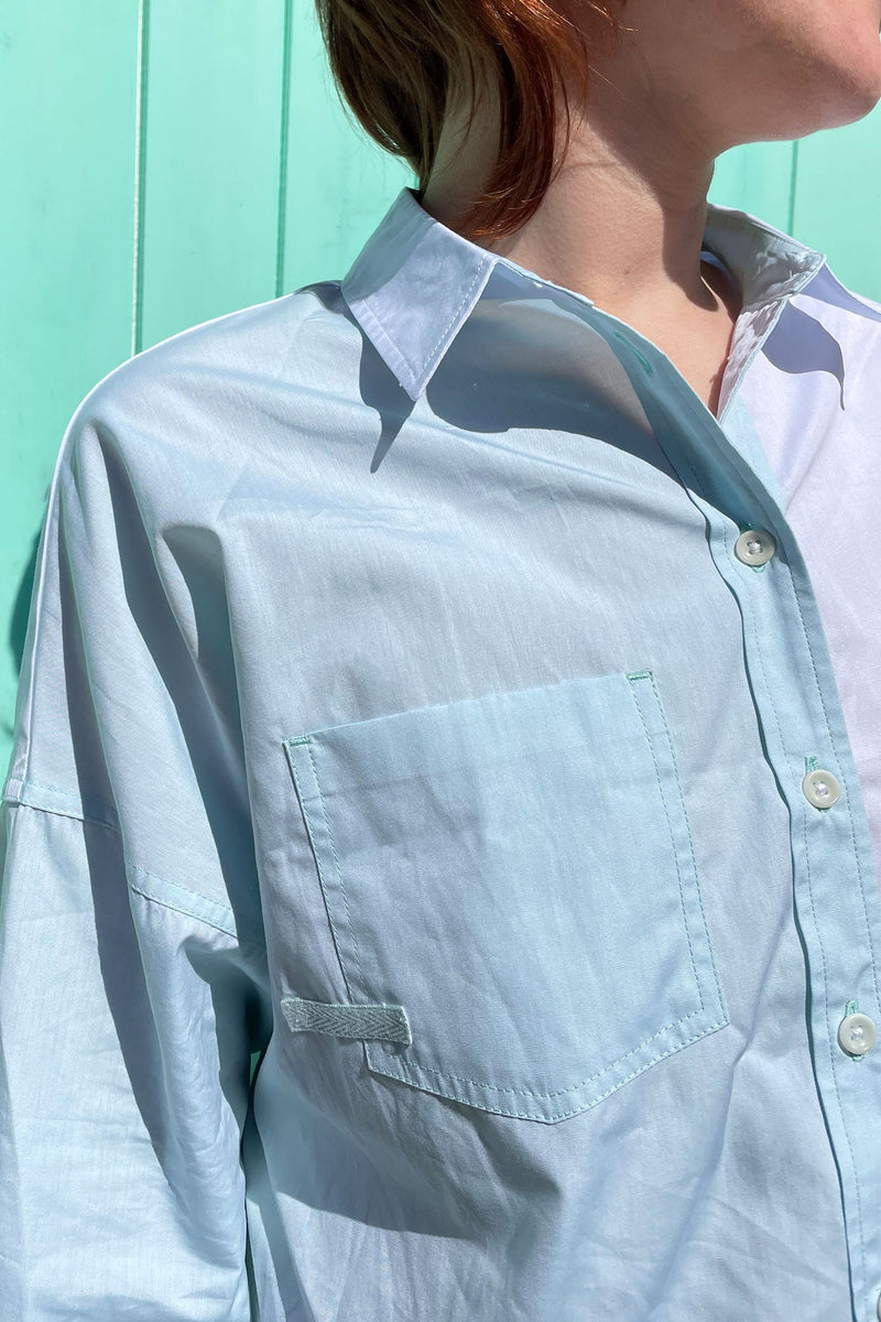 Close up of pocket on the Saywood pastel green and blue colourblock Lela Boxy Shirt in cotton. With contrasting front body panels and pockets. Pocket and body panels are in the soft green pastel colour. Made in the UK