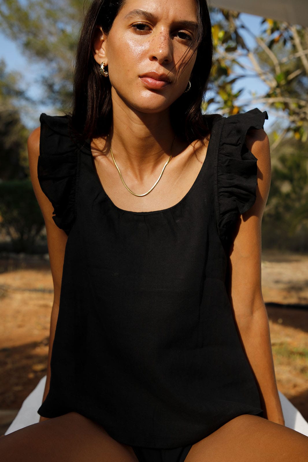 arkitaip Blouses The Jeanne Ruffled Top in black