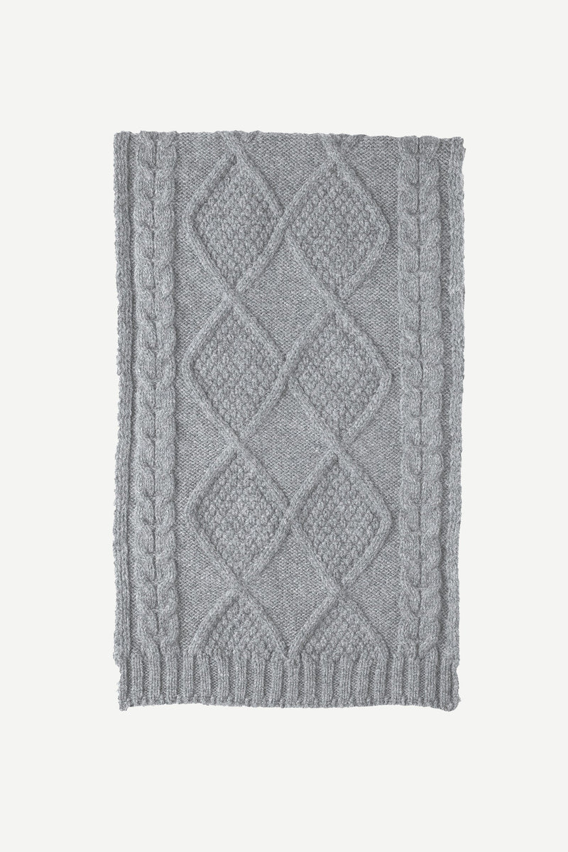 Ciaran scarf is expertly crafted in Scotland from 100% pure lambswool. The Ciaran scarf features an all-over cable stitch design. Sustainable pure wool essentials. 100% pure lambswool. Made in Scotland.