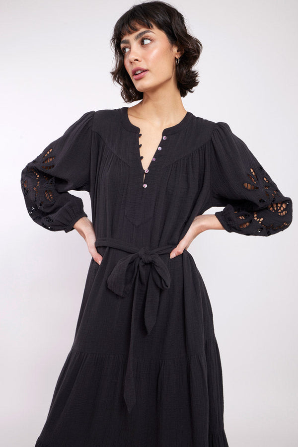 Model wearing Brigetta Black Organic Cotton Embroidered Dress by East.co.uk
