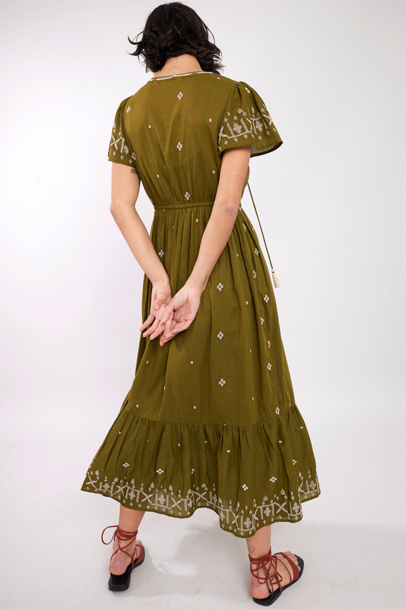 Model wearing Solaris Olive BCI Cotton Embroidered Dress by East.co.uk