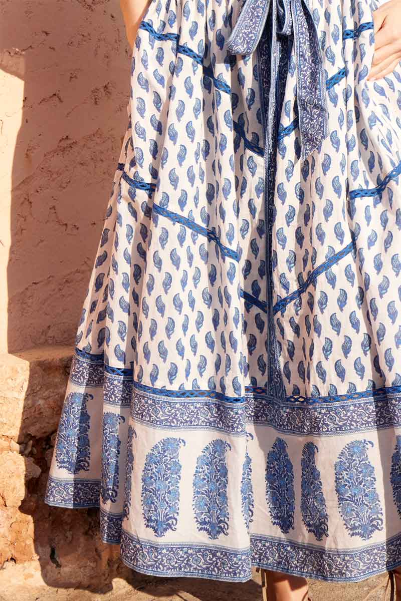 Close up of the skirt of the East Heritage Faith Blue Organic Cotton Belted Dress