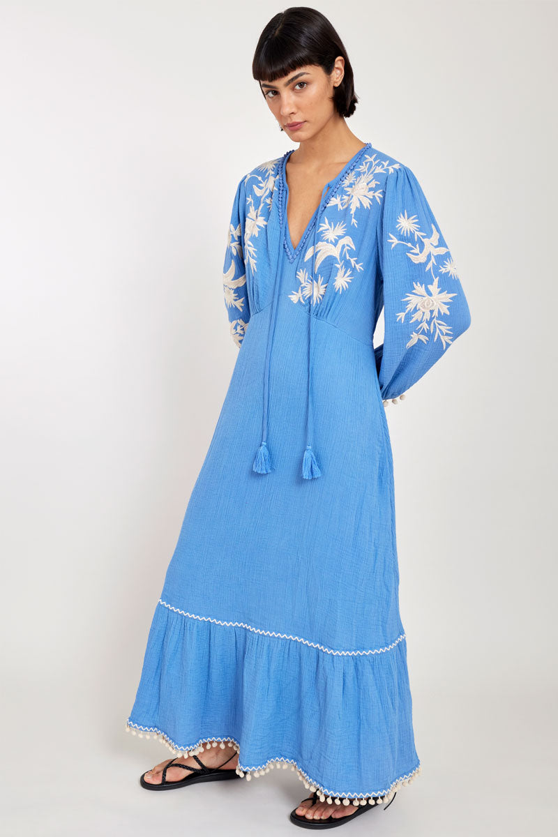 Model wears East Fern Embroidered Blue Cotton Gauze Dress
