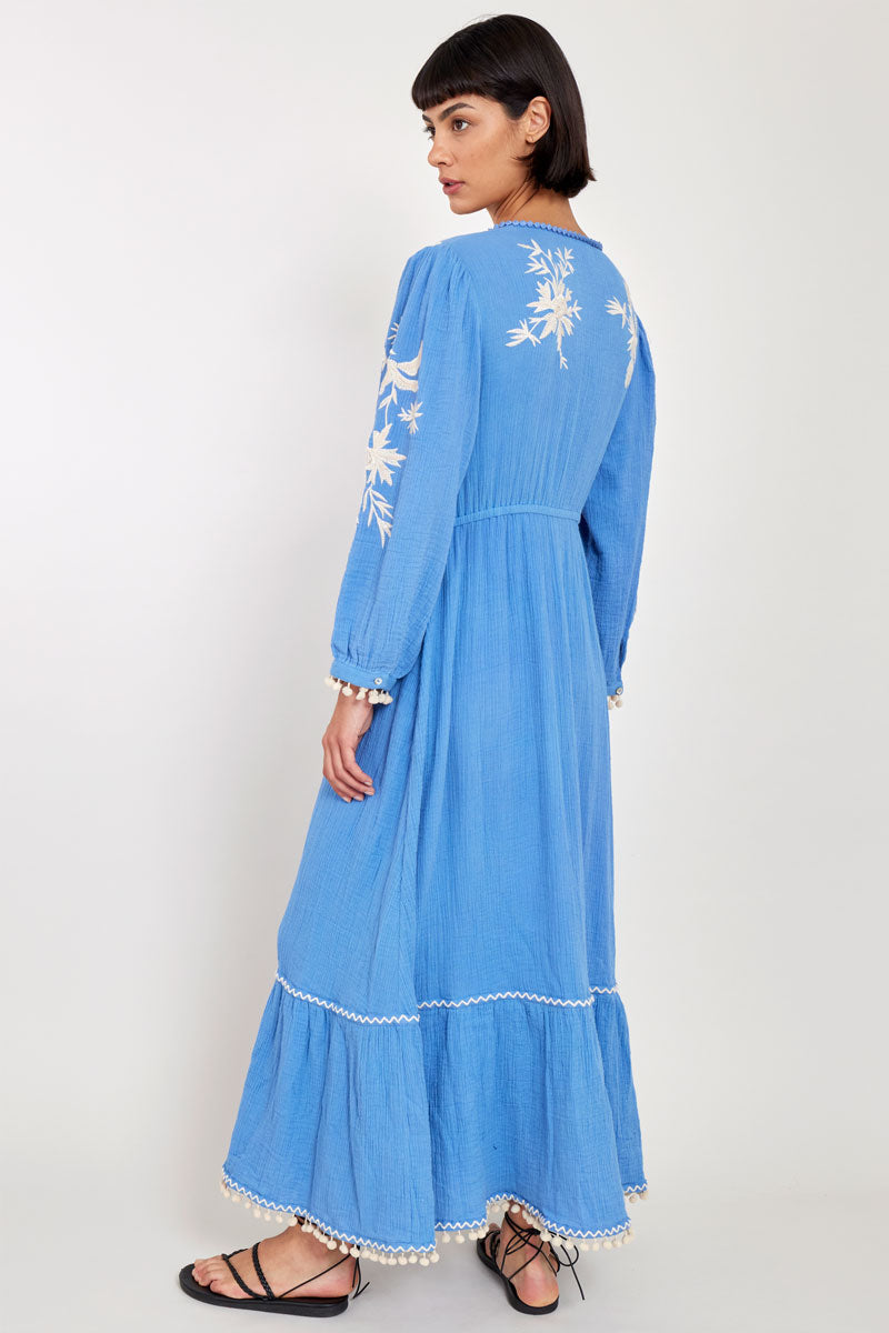 Model wears East Fern Embroidered Blue Cotton Gauze Dress