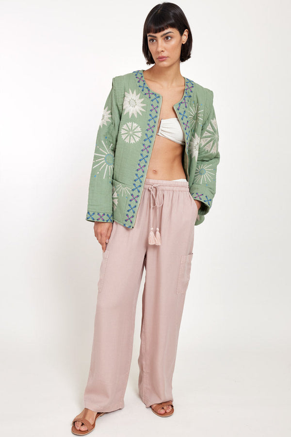 Model wears East Odell Sage Embroidered Jacket open with bikini underneath