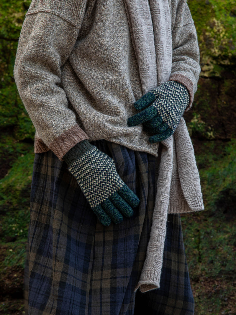 Model wears British Made Unisex Merino Wool Marl Gloves in Forest Green and garter Stitch Scarf in Grey