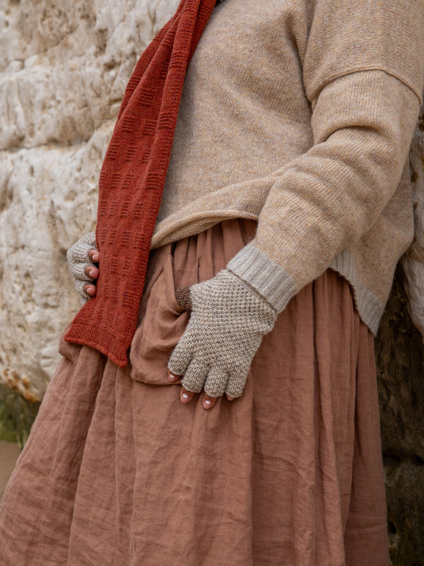 Model wears British Made British Wool Fingerless Gloves in Un-Dyed Nepp and Garter Stitch Scarf in Rust