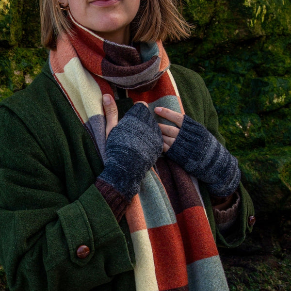 Model wears British Made Womens Purl Stitch Wrist Warmers in Charcoal and multi coloured chequerboardwool scarf