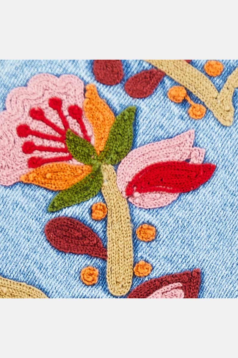 Detail of embroidery on East Feyre Denim Gilet
