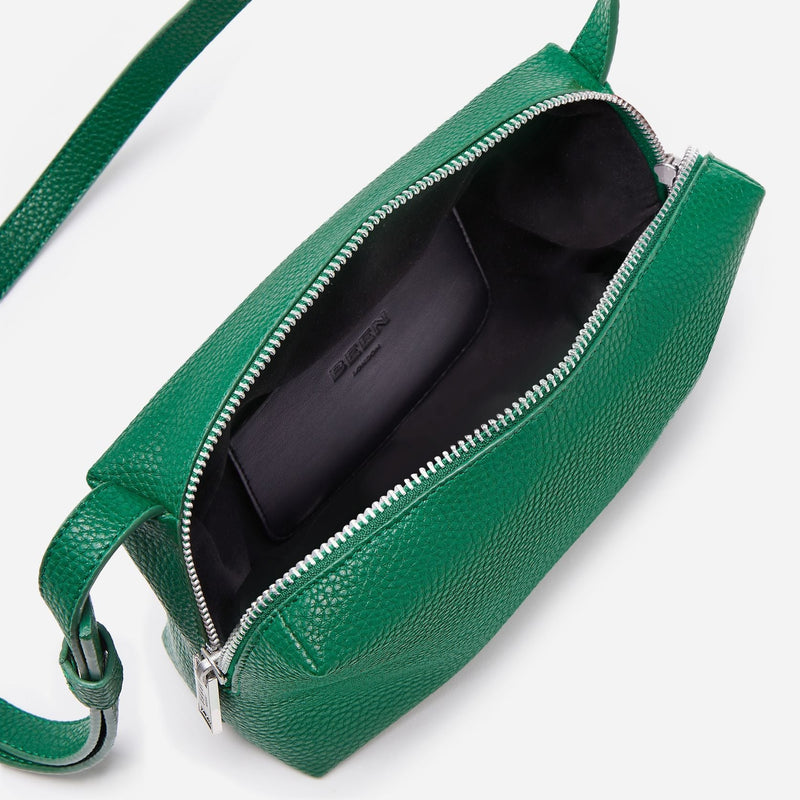 Interior of Rees Pebbled Recycled Leather Camera Bag in Rainforest Green showing suede-like lining and handy internal pocket